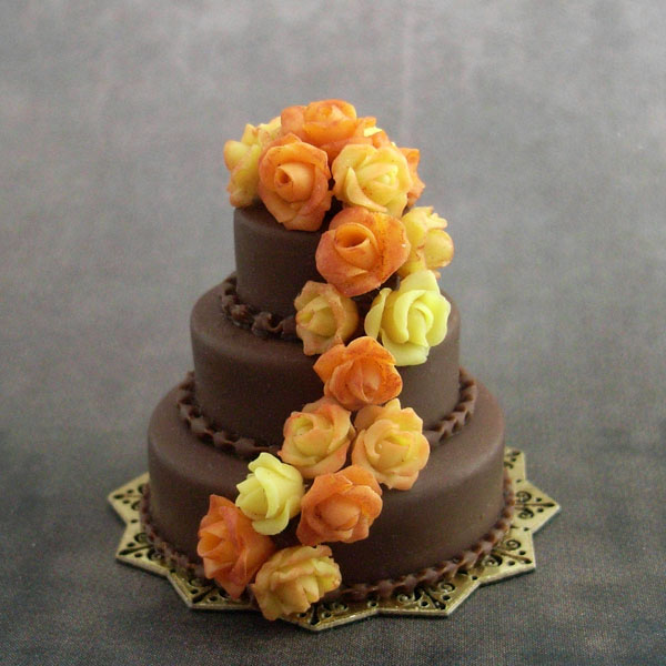 Chocolate three-tiered wedding cake in fall colors