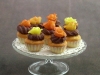 Chocolate cupcakes in fall colors on glass stand