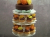 Chocolate cupcakes tower in fall colors on glass stand